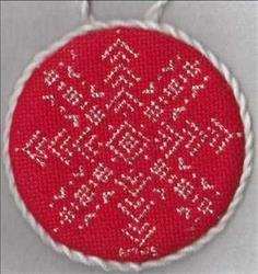 Stitched on red fabric.