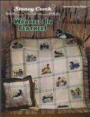Wrapped in Feathers | Cover: Various ducks stitched on afghan.